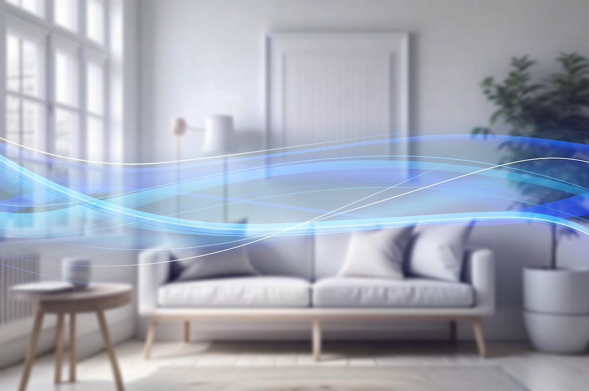 Modern living room with a white sofa, wooden table, and light blue abstract lines.